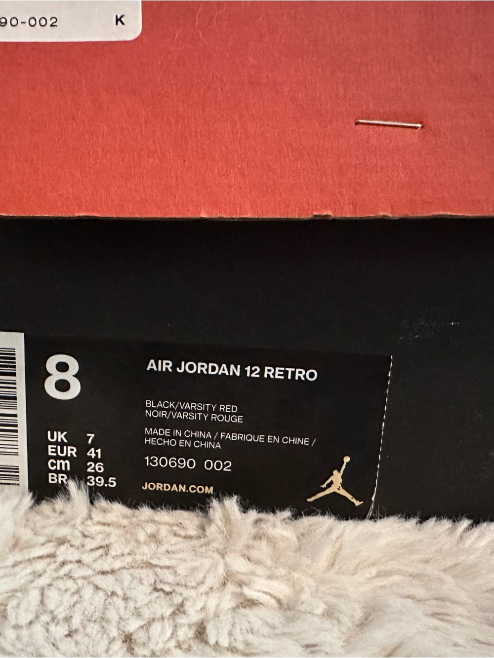 Jordan Black and Red Sneaker Receipt Overlaid on Shoe